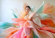 © Sandra Chia - Fashion editorial Concept. Pale asian girl of high fashion couture tulle flowing conceptual and pleats petal like pastel colourful bridal angel dress. dynamic composition lighting. copy text space