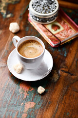 Wall Mural - Cup of coffee on wooden background. Soft focus. Copy space