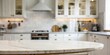 © Valeriia - A kitchen with a white countertop and a white oven. The countertop is round and has a marble top
