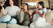 © HockleyM4/peopleimages.com - Woman, friends and laugh with tv, comedy special and living room for smile and movies. People, reunion and bonding with entertainment, conversation or discussion for communication on couch with joke