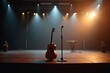 © kin - A microphone and guitar await on stage, capturing the essence of anticipation and artistic expression.