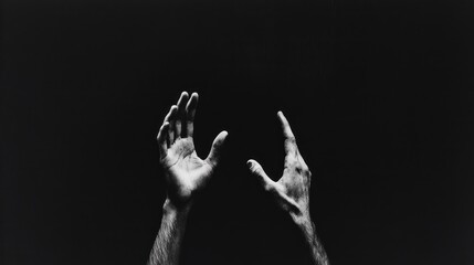 Poster - In the depths of shadow, two hands stretch towards the unseen, embodying yearning and vulnerability. This poignant moment captures the human desire for connection, hope, and illumination