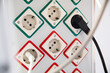 © Johnér - Plugs attached to electric outlets