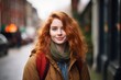 © Stocknterias - Portrait of a beautiful young woman with red hair in the city