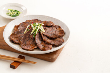 Wall Mural - Taiwanese braised beef shank slices in a plate on white table background.