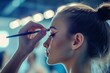 © Dream maker - Gymnast prepares for performance with makeup and hair styling in a backstage setting