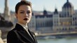 © Thavesak - Stylish Hungarian Woman with Sharp Features Posing in Front of Modern Architecture