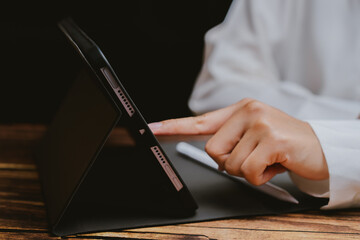 Poster - Close-Up of Hand Tapping Touch Screen Tablet in Office Setting
