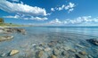 © Saxena - Serene Blue Sea and Sky with Puffy Clouds on a Clear Day: Peaceful Oceanic Panorama Background Concept for Calm and Tranquility Searches