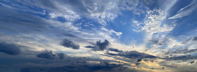 Wall Mural - dramatic sky, sunset background. blue sky with clouds and sun light
