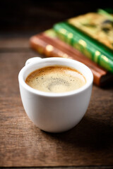 Wall Mural - Cup of coffee on wooden background. Soft focus. Copy space