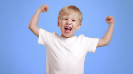 Poster - Woman express joy and enthusiasm through gestures of victory and happiness.