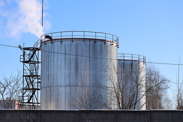Aufkleber - Large industrial equipment stored on a concrete barrier.