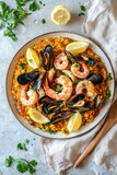 Delicious seafood paella on white background