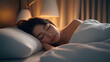 © Namhom - Peaceful sleep concept, cozy bedroom with soft lighting, person sleeping soundly