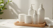 © Capruok - White Cosmetic Bottles and Jars on Wooden Tray