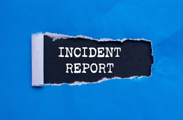 incident report message written on ripped torn blue paper on black background. conceptual incident r