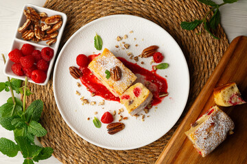 Wall Mural - Delicious white chocolate brownie with walnuts and raspberries.