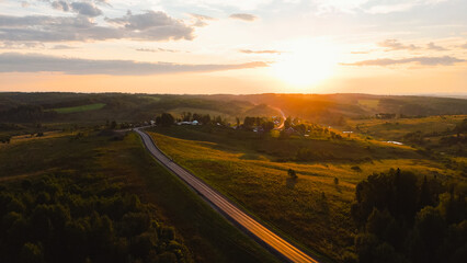 Wall Mural - The car is driving along the highway at dawn