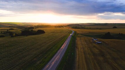 Wall Mural - The car is driving along the highway at dawn