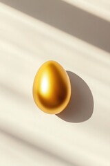Poster - minimalist design with single golden easter egg on white background shadows softly cast to emphasize
