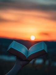 Poster - Open book held against a stunning sunset over the horizon. Generative AI