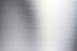 © tonstock - Shiny brushed stainless steel surface showcasing texture and elegance.