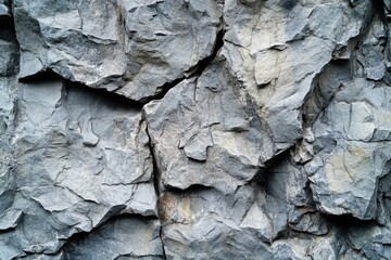 Poster - Close up of a rugged gray rock face showcasing intricate textures and natural patterns for geological study and design