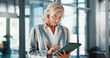 © PeakPoints/peopleimages.com - Tablet, reading and mature businesswoman in office checking company revenue margin for stock market. Digital technology, research and female finance executive with online investment profit report.
