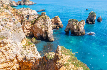 Wall Mural - Beach photographed near Portimão in the Algarve region of Portugal