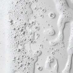 Poster - Abstract close up of clear water bubbles and foam on a white surface creating a clean and fresh visual texture perfect for cosmetic and hygiene product background