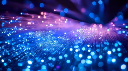 Poster - Glowing fiber optic strands emit blue and purple light against dark background, creating luminous bokeh effect and futuristic technology atmosphere.