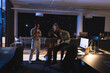 © Wavebreak Media - Business diverse professionals collaborating on tablet in modern office during late night