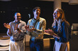© Wavebreak Media - In office, business diverse professionals clapping and laughing during late-night meeting