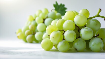 Poster - Fresh green grapes on a marble surface with soft lighting showcasing their texture and color