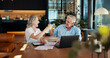 © peopleimages.com - Toast, success and laptop with old couple at home for social security benefits, annuity growth and retirement fund. Account balance, online banking and 401k withdrawal with people and cheers