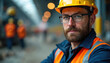 © Vadym - Confident male construction worker in hard hat, safety glasses. Blue jacket, orange safety vest. Ready, challenging day at job site. Focus on safety, industry, skilled labor, career. Safety