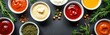 © Vadym - Top view of different sauces in bowls with seasonings banner. Ketchup mustard pesto mayonnaise horseradish dips assortment. Rosemary dill thyme peppercorns with copyspace for food bloggers, cooking