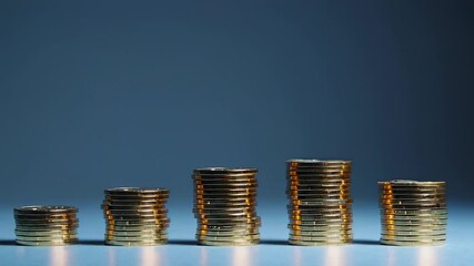 Poster - Golden coins steadily building up into ascending stacks against deep blue background, symbolizing financial growth, investment progress, and increasing wealth accumulation