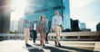 © peopleimages.com - Corporate, walking and business people in city in discussion on morning commute, travel and journey. Professional, team of men and women in town talking for collaboration, meeting and career