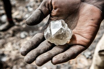 Poster - Miners hand holding rough cut crystal in African site. Generative AI