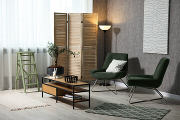 Poster - living room with stylish furniture and grey wall. interior design