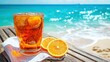 © mlangsen - Iced tea with orange on beach boardwalk, ocean view