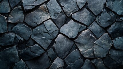 Poster - Close-up view of a dark blue stone wall texture. The stones are irregular in shape and size, creating a rough, natural look. Dark Stone Wall Texture: A Deep Blue Irregular Pattern