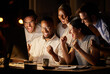 © Nina Lawrenson/peopleimages.com - Business, night and teamwork with celebration by computer for app development success, good news or achievement. Web developer, people and victory fist in office for server update deadline or support