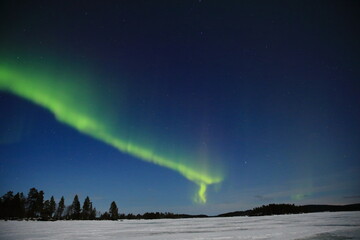 aurora borealis seen at lake inari, northern finland