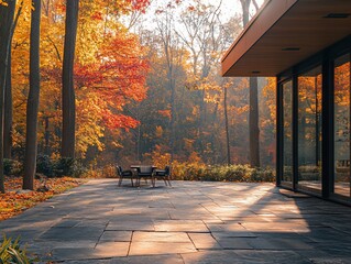 Poster - Autumnal patio scene with modern house, stone patio, and vibrant fall foliage.