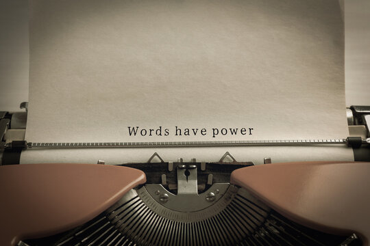 Typewriter with sheet of paper, closeup. Typed text Words Have Power
