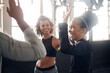 © peopleimages.com - High five, happy and women in gym for fitness, training and workout target, teamwork and goals. Sports, morning and friends celebrate with gesture for exercise, health and performance in class