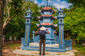 Wall Mural - male tourist traveler at the temple on Buddhist pagoda in Da Nang, Vietnam. Travel and tourism in Asia